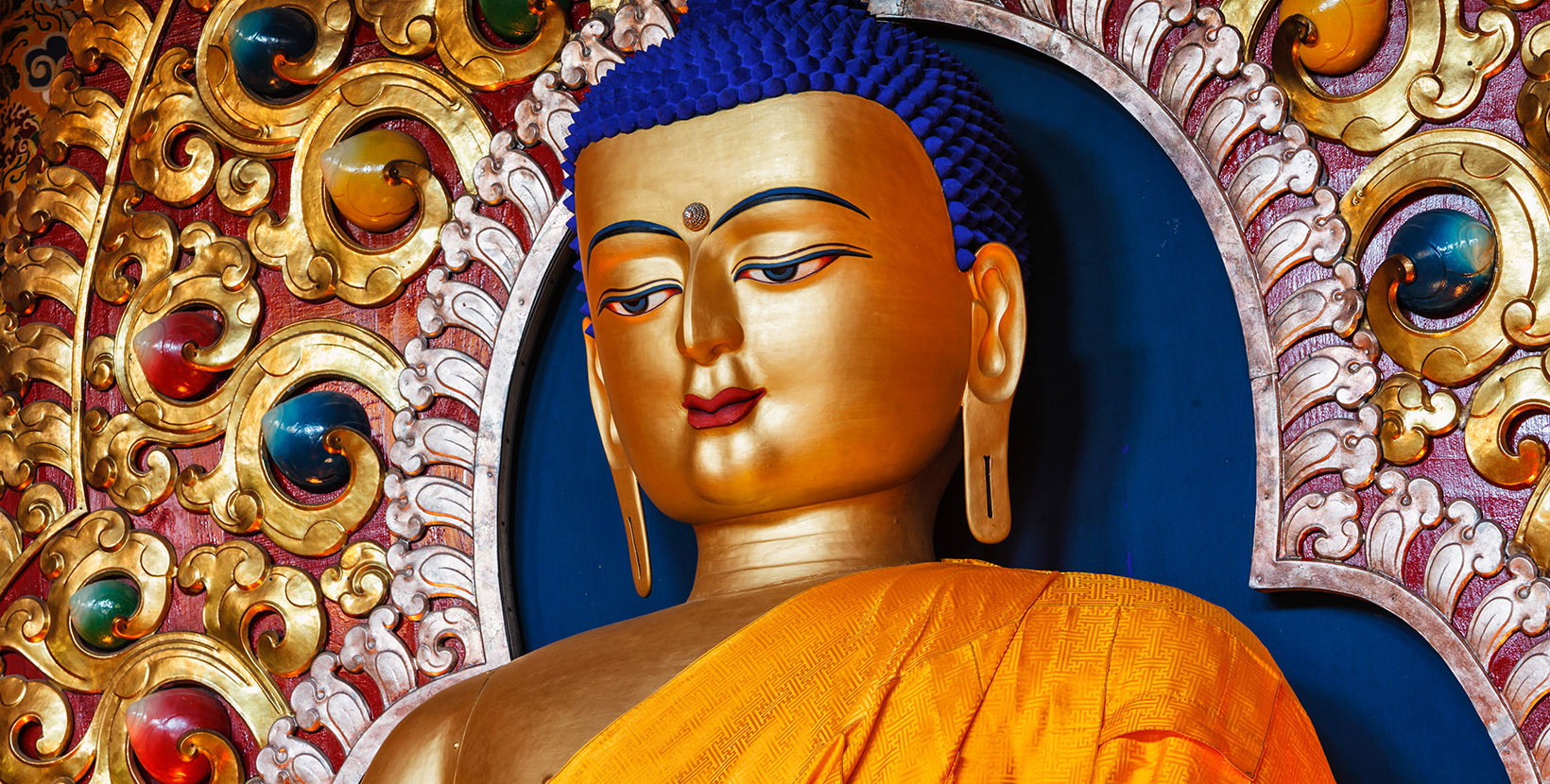 Gilded statue of Sakyamuni Buddha in Tsuglagkhang temple. McLeod Ganj, Himachal Pradesh, India