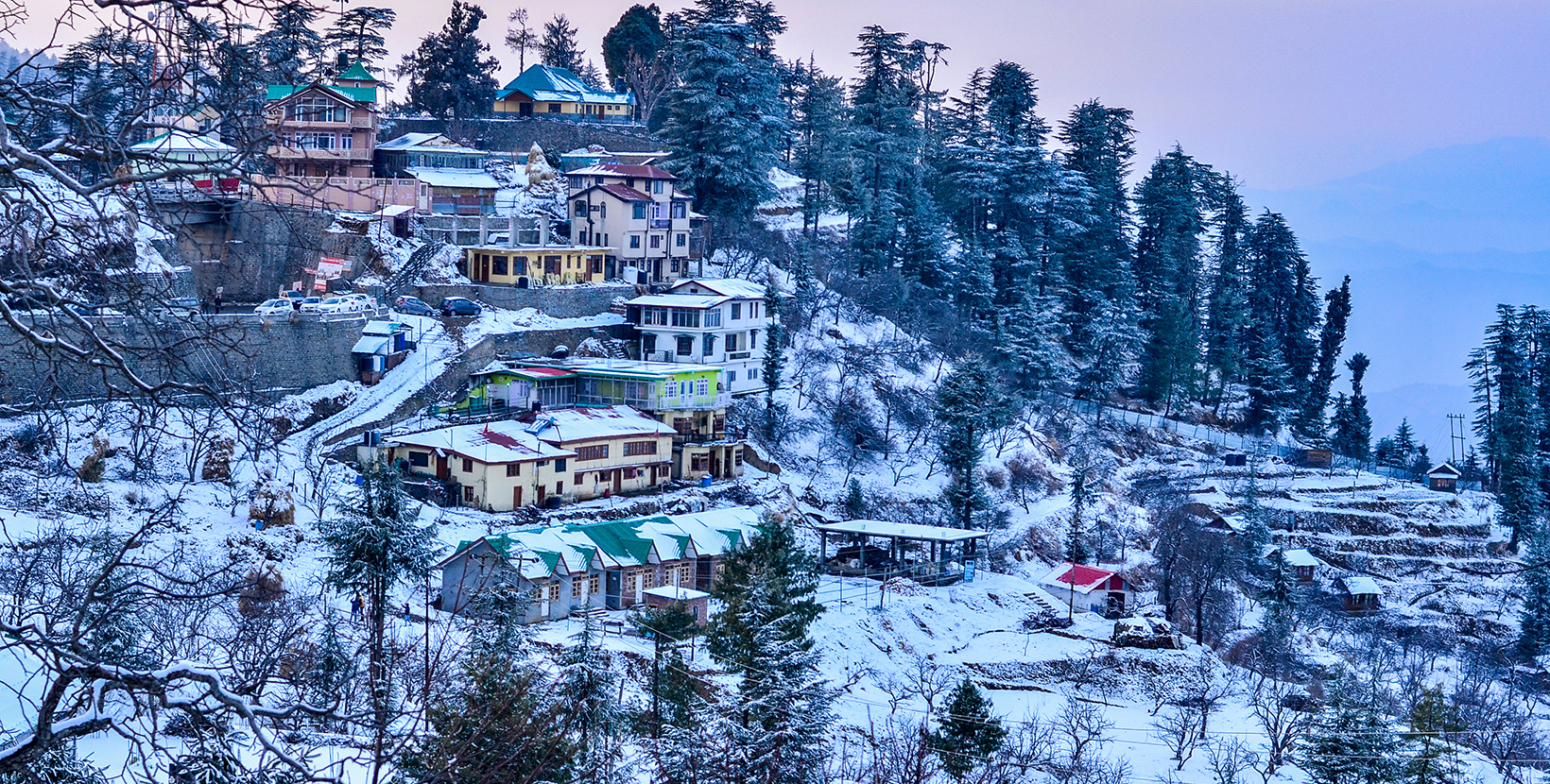 View of Kufri, Auli village 15 Kms above Shimla, Himachal Pradesh, India at sunset. It is a popular winter getaway where people come to enjoy snowfall, skiing and winter sports. 