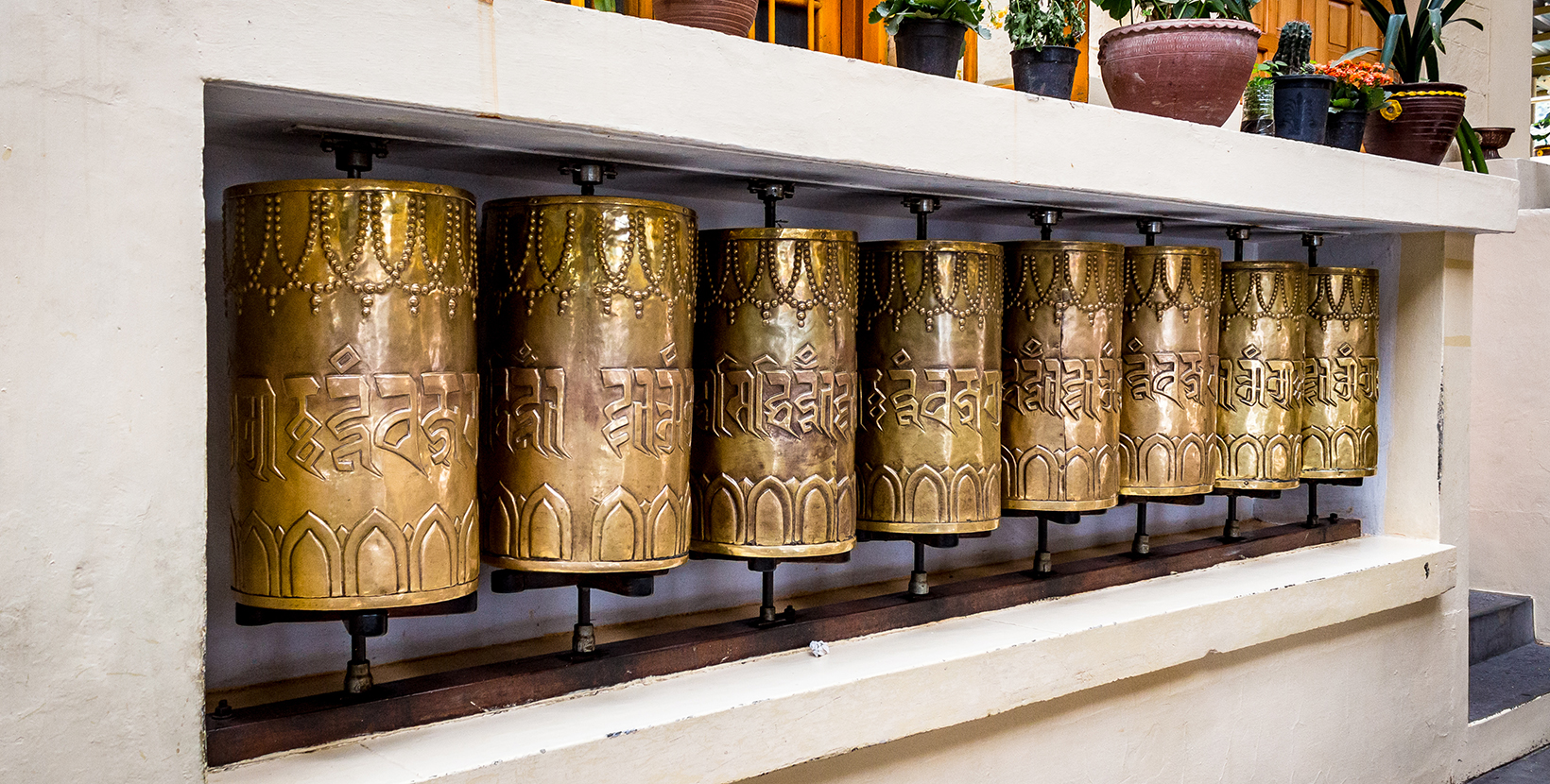 Prayer Wheels located in Tsuglagkhang Complex Monastery in Dharamshala situated in Himachal Pradesh India. It is believed spinning these wheels brings good fortune in your life. Travel Photography.