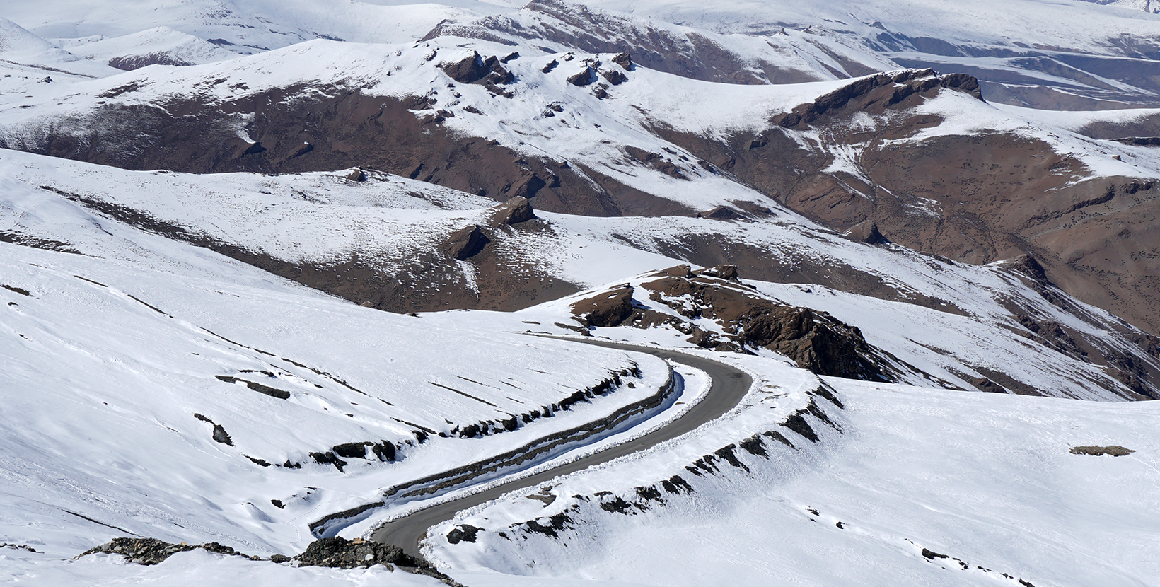 Natural Scene  High Roadway with white Snow on the  himalaya snow mountain at tanglang la pass in winter season at Leh Ladakh , India