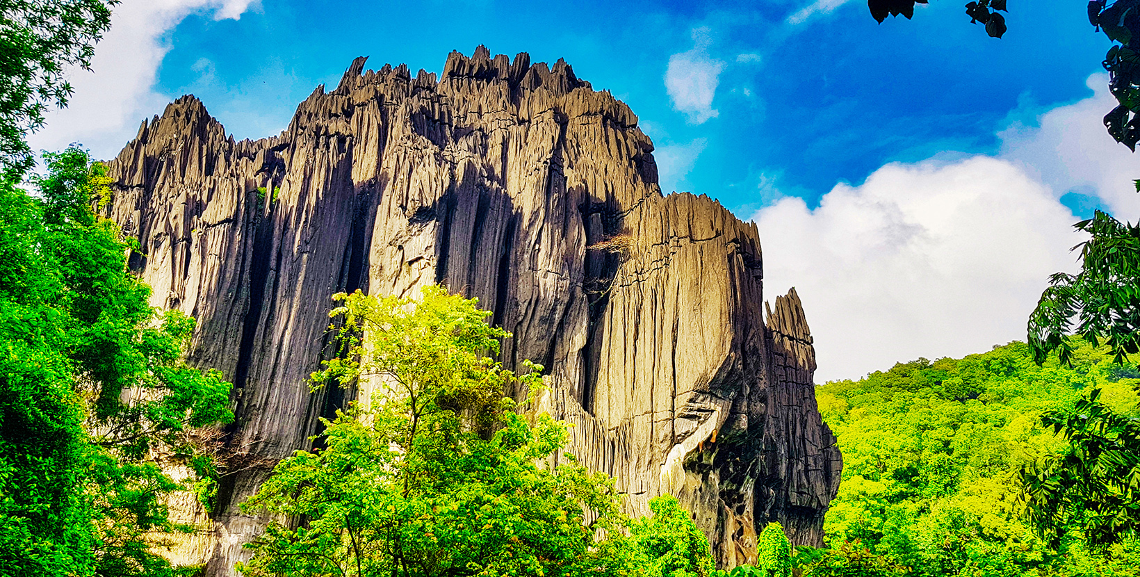 Located in Karnataka, India, this is an old stone formation with caves inside .