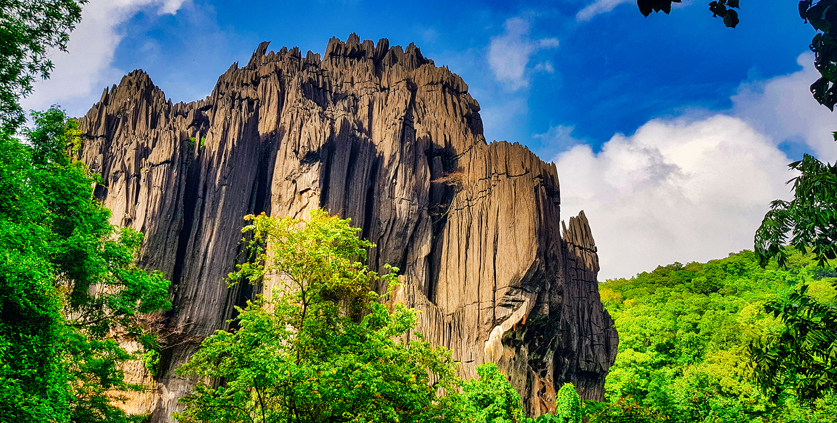 Located in Karnataka, India, this is an old stone formation with caves inside .