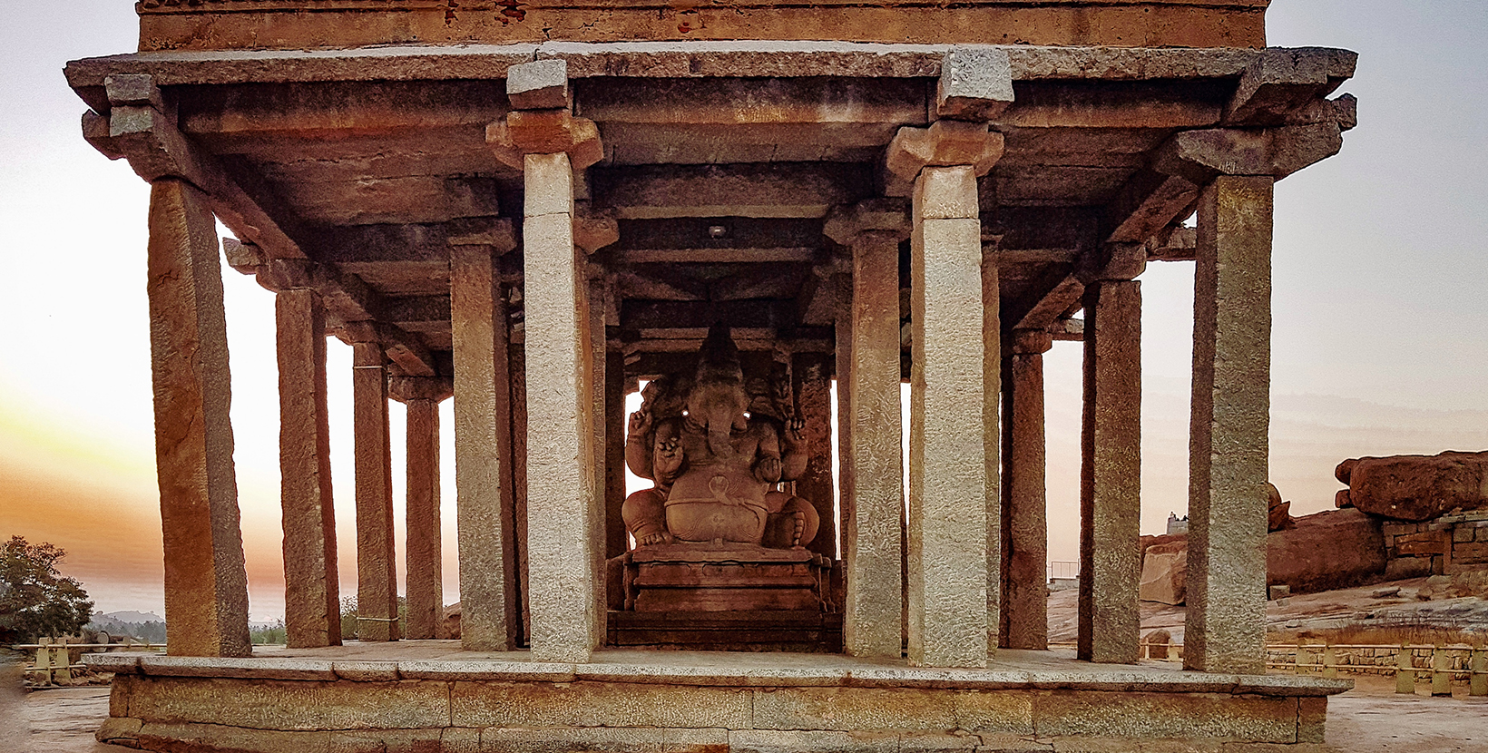 The statue of Lord Ganesha built in ancient times in Sasivekalu temple, Hampi with the color tone of autumn