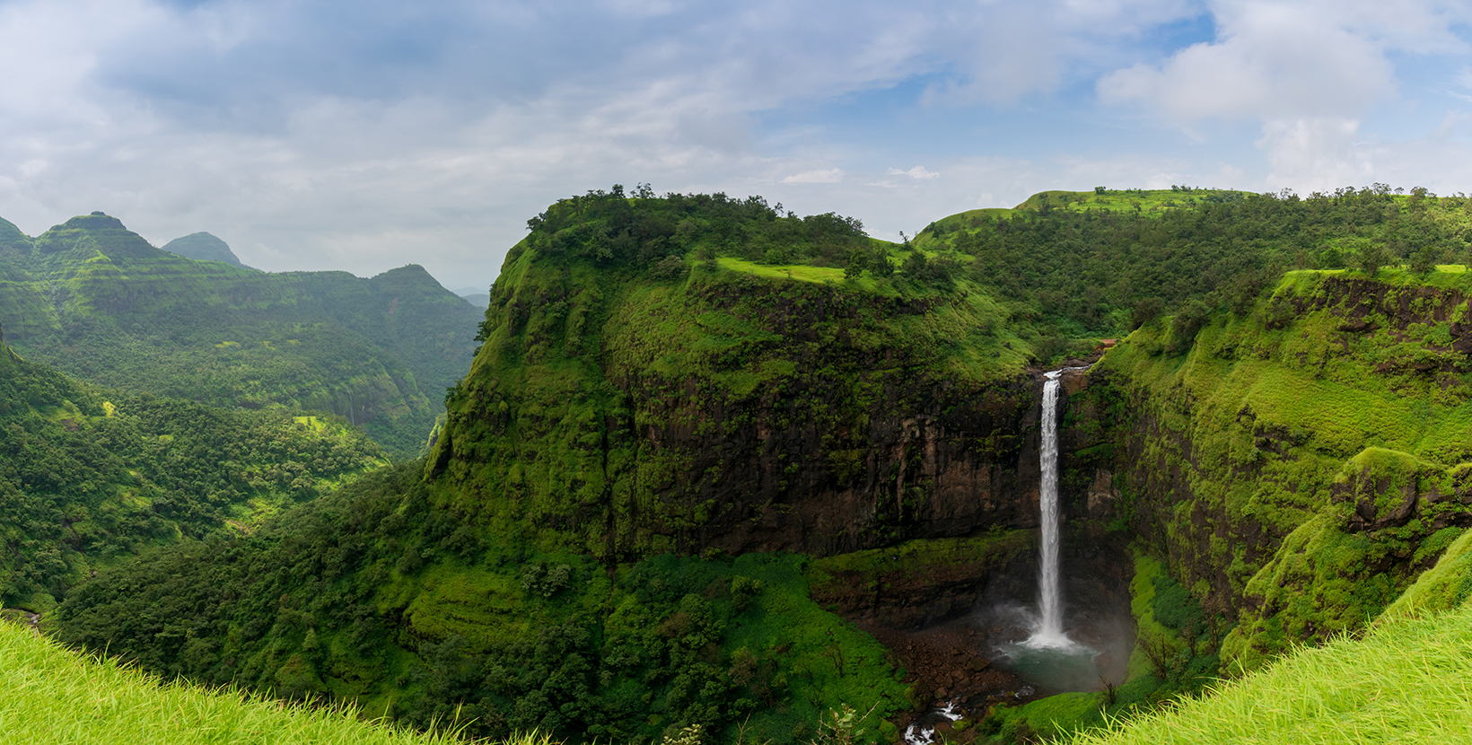 Beautiful waterfall with dramatic sky, somewhere in the Sahyadri ranges of western ghats of Maharashtra