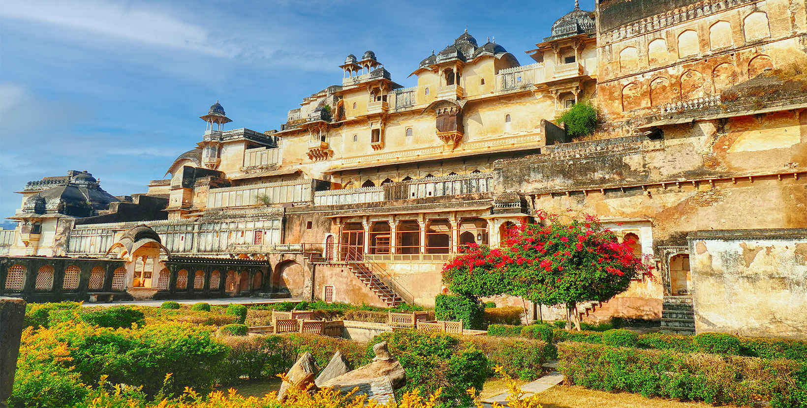 The Bundi palace view with nearby greenery against a blue sky in India