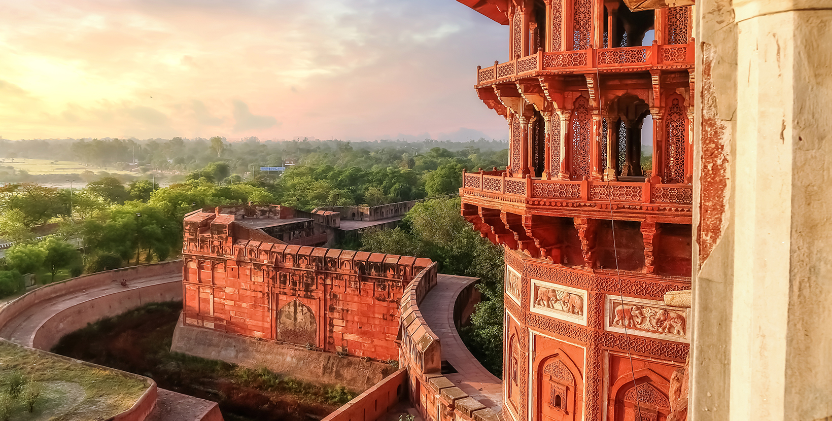 Agra Fort - Famous medieval historic fort exterior structure with view of Agra city landscape at sunrise; Shutterstock ID 1418576429; purchase_order: -; job: -; client: -; other: -