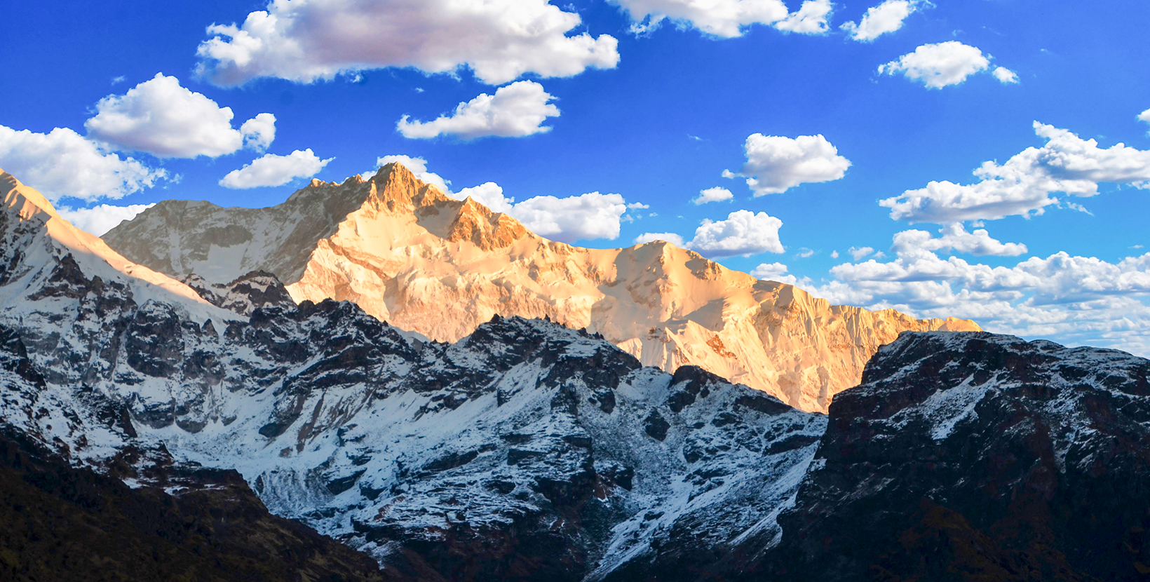 Mt Khangchendzonga or the Kanchanjunga the world third highest peak as seen from one of the most viral Dzongri Goechala trek in Yuksom west Sikkim (India). HD Photo of Goechala Trek